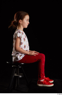Lilly  1 dressed red leggings red shoes sitting t…